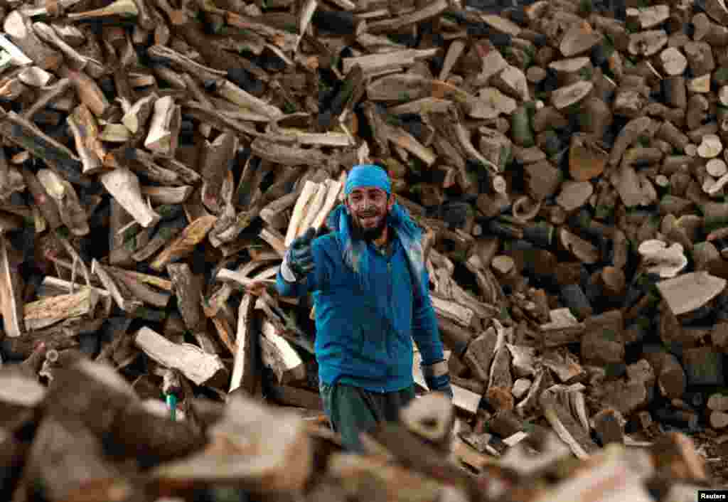 An Afghan man works at his firewood stall in Kabul. (Reuters/Mohammad Ismail)