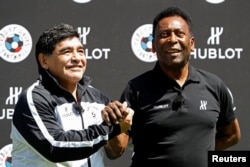 Football legends Diego Maradona (left) and Pele attend an event on the eve of the opening of the UEFA 2016 European Championship in Paris.