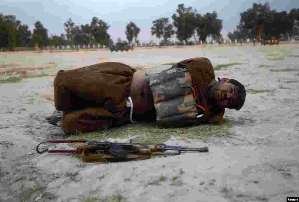 A would-be suicide attacker lies on the ground after his vest was defused in Jalalabad Province. Afghan security forces captured the attacker before he blew himself up. (Reuters/Parwiz)