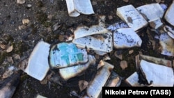 Burned books outside a school in Sterlitamak following a knife and arson attack on April 18.