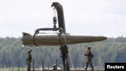 Russian servicemen equip an Iskander tactical missile system at the Army-2015 international military-technical forum in Kubinka in June.