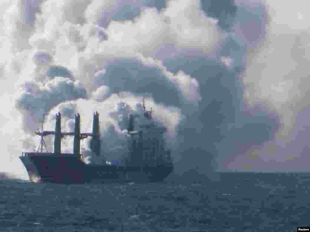 The cargo vessel Purple Beach, loaded with fertilizers, is engulfed in smoke, west of Helgoland, Germany, on May 27. The fire could not be extinguished and subsequently all crew had to be evacuated. (Reuters/Havariekommando)