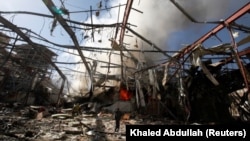 Smoke rises at a community hall where Saudi-led warplanes struck a funeral in Sanaa, the capital of Yemen, in October 2016.