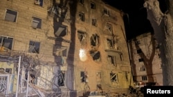 An image shows the aftermath of a Russian air strike that hit near a residential building in a central area of the Ukrainian city of Sumy.