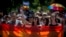 People carry rainbow-colored banners and flags during a gay-pride parade in Belgrade in June.