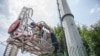 An Iranian man attempts to commit suicide by leaping from a communication's tower in central Tehran in protest to corruption and poverty, Ju;y 8, 2014