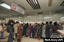 Mongolians wait in lines to buy meat in Ulan Bator in 1988.