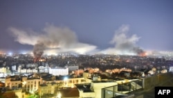 Smoke rises from the site of an Israeli air strike that targeted a neighborhood in Beirut's southern suburbs on October 3.