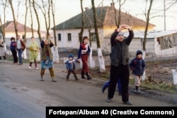 Villagers cheering the revolution on a village street in Romania's Transylvania region.