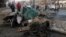 Civilians inspect the aftermath of car bomb attack that exploded in Baghdad earlier this week. Iraq has been gripped by violence in recent months. 