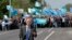 Crimean Tatar leader Mustafa Dzhemilev was met by supporters when he attempted to enter Crimea on May 3. Blocking his entry has increased tensions on the peninsula.
