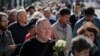 People line up to pay the last respects at the coffin of former Soviet President Mikhail Gorbachev during his funeral ceremony in Moscow on September 3. 