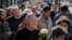 People line up to pay the last respects at the coffin of former Soviet President Mikhail Gorbachev during his funeral ceremony in Moscow on September 3. 