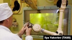 A technician operates a manipulator as he works with plutonium at the Mayak nuclear reprocessing plant in the Chelyabinsk region.