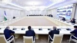 Uzbek President Shavkat Mirziyov (left) holds an emergency meeting on the coronavirus.