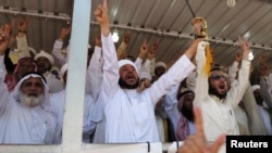 Sunni Muslims chant "Allahu Akbar", meaning "God is great", during an anti-government demonstration in Ramadi on April 26.