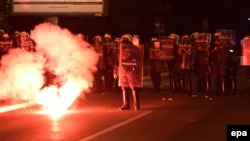 Antigovernment protesters clash with police in Podgorica on October 18. The government accuses Russia and Serbia of stirring up trouble.