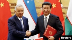Председатель КНР Си Цзиньпин и президент Узбекистана Ислам Каримов. 