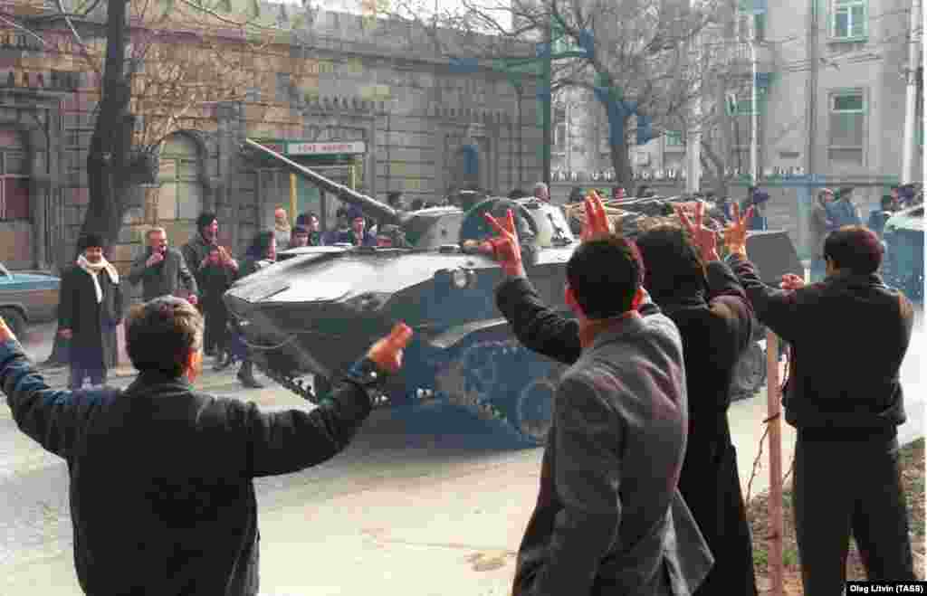 Residents of Baku wave to Soviet tanks entering their city.&nbsp;More than 26,000 Soviet troops invaded the capital of the Azerbaijan Soviet Socialist Republic on the night of January 19,1990.&nbsp;