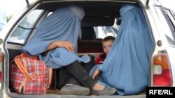 Afghan women in the back of a car in the capital, Kabul