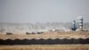 Iraqi security forces vehicles are seen in Fallujah on June 17.