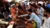 Residents buy dates at a market ahead of Ramadan during a government-imposed nationwide lockdown to stem the spread of the coronavirus, in Karachi on April 20.