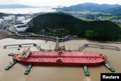 CHINA -- An oil tanker is seen at a crude oil terminal in Ningbo Zhoushan port, Zhejiang province, China May 16, 2017. Picture taken May 16, 2017.