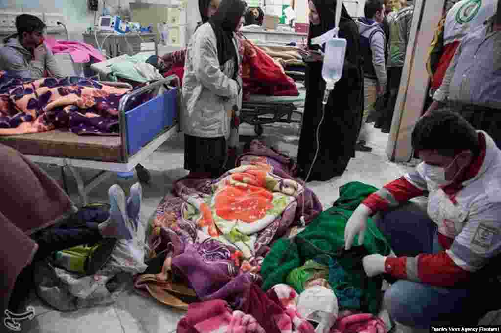 People receive treatment in Sarpol-e Zahab.