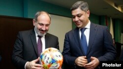 Armenia - Prime Minister Nikol Pashinian (L) and National Security Service Director Artur Vanetsian visit the Football Academy in Yerevan, March 25, 2019.