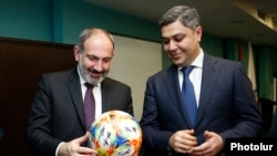 Armenia - Prime Minister Nikol Pashinian (L) and National Security Service Director Artur Vanetsian visit the Football Academy in Yerevan, March 25, 2019.