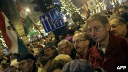 Ex-Prime Minister Ferenc Gyurcsany (right front) joined tens of thousands of demonstrators in front of the opera building in Budapest on January 2 to protest the recent legislative changes.