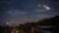A picture taken early on January 21, 2019 shows Syrian air defense batteries responding to what the Syrian state media said were Israeli missiles targeting Damascus.