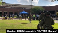 Law enforcement officers respond to the shooting at Santa Fe High School in Texas on May 18.