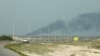 Дым над НПЗ Aramco в Рас-Танура, Саудовская Аравия