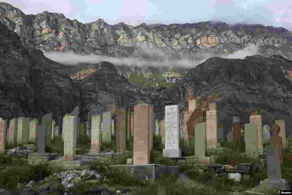 Mountain mist floats above Gimry&#39;s village cemetery.&nbsp;