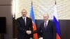 Russian President Vladimir Putin shakes hands with Azerbaijani President Ilham Aliyev during their meeting in Moscow, Russia, Sept. 1, 2018