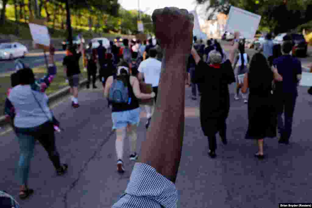 Marchers take part in a Juneteenth Awareness Walk to demonstrate against racial inequality in the aftermath of the death in Minneapolis police custody of George Floyd, in Boston, Massachusetts, U.S., June 18, 2020. REUTERS/Brian Snyder