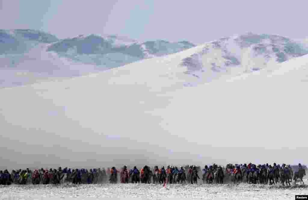 Riders attend a spring horse-racing event in Tsagaan Khutul, outside of Ulan Bator, Mongolia. (Reuters/Rentsendorj Bazarsukh) 