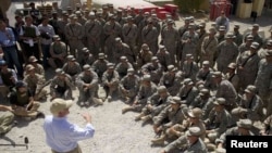 U.S. Secretary of Defense Robert Gates speaks with troops from the 1st Brigade, 4th Infantry Division, as he visits Forward Operation Base Camp Nathan Smith outside Kandahar.