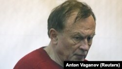 Russian historian and professor Oleg Sokolov is accused of murdering his girlfriend and former student. 