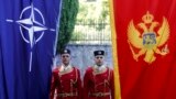 Montenegro -- Montenegrin honor guards stand next to NATO and Montenegrin flags during a ceremony in the capital Podgorica, June 7, 2017
