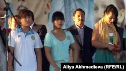 Kazakh weightlifters: Maya Maneza (L), Zulfiya Chinshanlo (C), Svetlana Podobedova (R), Olympic champions. Taldykorgan, August 2012.