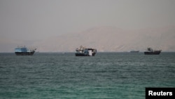 Vessels pass through the Strait of Hormuz on June 22.
