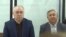 Omurbek Tekebaev and Duishonkul Chotonov in a Bishkek courtroom. 
