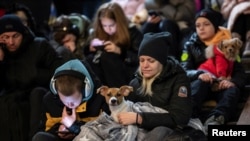 People take shelter inside a subway station during massive Russian missile attacks in Kyiv on February 10.