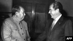 Chinese President Mao Zedong (left) shakes hands with U.S. President Richard Nixon at their meeting in Beijing in February 1972, one year after Zhuang Zedong's daring personal overture.