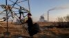 KOSOVO --Roma children play near by coal-fired power plants between houses in the town of Obilic, near the capital Pristina, November 14, 2018