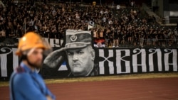 Partizan Belgrade supporters display a banner depicting former Bosnian Serb military chief Ratko Mladic during the Serbian SuperLiga football match between Partizan Belgrade and OFK Beograd in Belgrade on August 31, 2026, days after Mladic died at the age