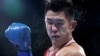 Казахстанский боксер Бекзат Нурдаулетов в бою против российского спортсмена Имама Хатаева на Олимпиаде в Токио. Август 2021 года