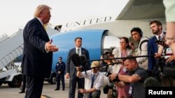US President Donald Trump speaks to reporters before a flight to Miami from West Palm Beach, Florida.